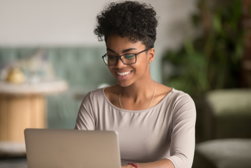 happy client smiling on computer