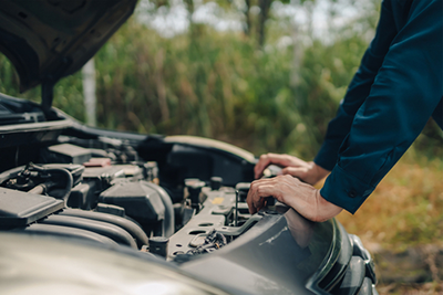 mechanic inspecting car engine